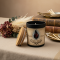 Candle with a decorative label featuring a flame design on a white background